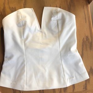 Cream strapless top.